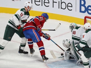 Montreal Canadiens' Max Pacioretty (67) makes his way past Minnesota Wild's Eric Staal (12) and Matt Dumba (24), and tries to get puck past goalie Devan Dubnyk, during second period NHL action in Montreal on Thursday November 9, 2017.