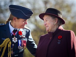 Governor General Julie Payette speaks with 2017 National Silver Cross Mother Diana Abel, right, during the National Remembrance Day Ceremony at the National War Memorial in Ottawa on Saturday, November 11, 2017. Ashley Fraser/Postmedia