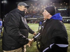 Université de Montréal head coach Danny Maciocia, right, congratulates Laval Rouge et Or coach Glen Constantin following Laval's victory in the Quebec university football championship game in Montreal Saturday November 12, 2016.