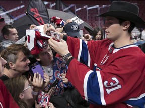 Injured Canadiens goalie Carey Price signs autographs to fans attending the team’s annual blood-donor clinic at the Bell Centre on Nov. 13, 2017.