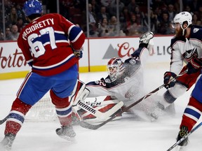 Columbus Blue Jackets goalie Sergei Bobrovsky stops Montreal Canadiens left wing Max Pacioretty as Columbus Blue Jackets defenceman David Savard sprays Bobrovsky with snow during NHL action in Montreal on Tuesday November 14, 2017.