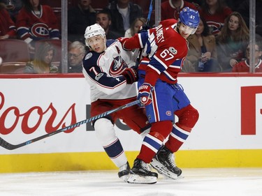 Montreal Canadiens left wing Max Pacioretty holds back Columbus Blue Jackets defenceman Jack Johnson during NHL action in Montreal on Tuesday November 14, 2017.
