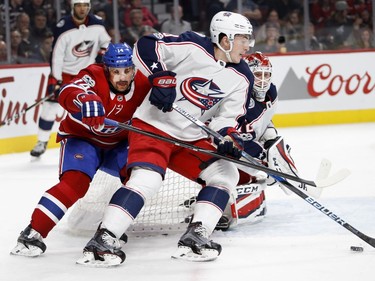 Montreal Canadiens centre Tomas Plekanec tries to get around Columbus Blue Jackets defenceman Zach Werenski as Columbus Blue Jackets goalie Sergei Bobrovsky follows the puck during NHL action in Montreal on Tuesday November 14, 2017.