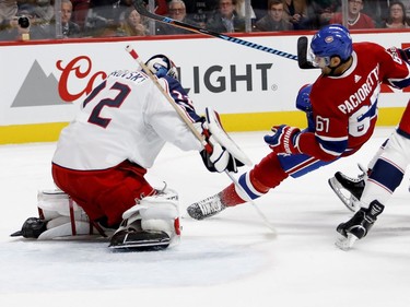 Montreal Canadiens left wing Max Pacioretty gets tripped up and hits the ice as Columbus Blue Jackets goalie Sergei Bobrovsky stops his shot during NHL action in Montreal on Tuesday November 14, 2017.