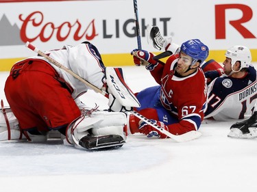 Montreal Canadiens left wing Max Pacioretty grimaces as he hits the ice after being tripped up by Columbus Blue Jackets centre Brandon Dubinsky as Columbus Blue Jackets goalie Sergei Bobrovsky covers up the puck during NHL action in Montreal on Tuesday November 14, 2017.