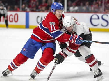 Montreal Canadiens Brendan Gallagher tries to skate past Arizona Coyotes Tobias Rieder during third period of National Hockey League game in Montreal Thursday November 16, 2017.