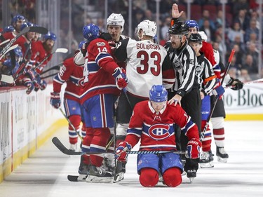 Montreal Canadiens Brendan Gallagher kneels on the ice after taking a check to the head by Arizona Coyotes Zac Rinaldo during third period of National Hockey League game in Montreal Thursday November 16, 2017. Rinaldo recieved a penalty on the play.