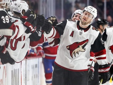 Arizona Coyotes Derek Stepan gets high fives from teammates after scoring a goal during third period of National Hockey League game against the Montreal Canadiens in Montreal Thursday November 16, 2017.