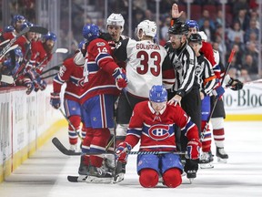 The Canadiens' Brendan Gallagher kneels on the ice after taking a check to the head from the Arizona Coyotes' Zac Rinaldo during third period of NHL game at the Bell Centre in Montreal on Nov. 16, 2017.