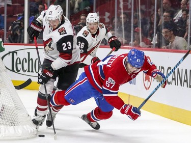 Montreal Canadiens Max Pacioretty is knocked off the puck by Arizona Coyotes Oliver Eckman-Larsson as teammate Christian Fischer watches during first period of National Hockey League game in Montreal Thursday November 16, 2017.