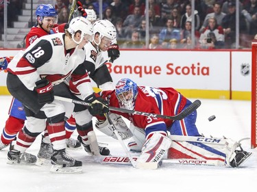 Arizona Coyotes Christian Dvorak, 18, shoots the puck past Montreal Canadiens goalie Charlie Lindgren for a goal during second period of National Hockey League game in Montreal Thursday November 16, 2017. Teammate Christian Fischer is right next to Dvorak.