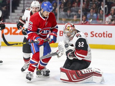 Montreal Canadiens Andrew Shaw watches as Arizona Coyotes goalie Antti Raanta juggles the puck during third period of National Hockey League game in Montreal Thursday November 16, 2017. Coyotes Oliver Eckman-Larsson is at rear.