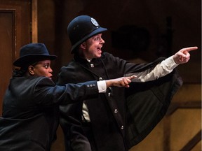 Lucinda Davis as Sheriff, left, and Trent Party as Lieutenant in a scene from the Centaur Theatre's production of The 39 Steps, a zany send-up of the Hitchcock film, in Montreal, Nov. 14, 2017.