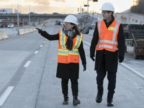 Montreal mayor Valerie Plante and Quebec transport minister André Fortin walk along what will be the new highway 20, in Montreal on Monday November 20, 2017. (Allen McInnis / MONTREAL GAZETTE)