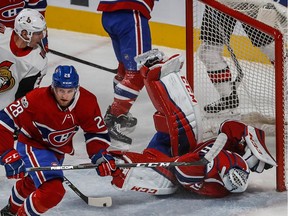 Montreal Canadiens goalie Carey Price (31) is hit by Ottawa Senators centre Nate Thompson (17) during 1st period action at the Bell Centre in Montreal, on Wednesday, November 29, 2017.