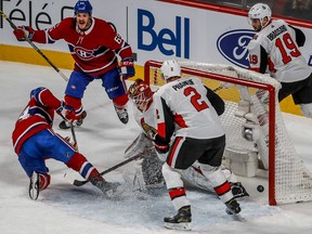 Canadiens right wing Andrew Shaw (65) celebrates after Phillip Danault (24) scores against Senators goalie Mike Condon as defenceman Dion Phaneuf looks on during 2nd period action at the Bell Centre Wednesday night.
