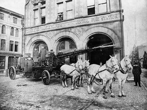 Firefighters and a horse-drawn firetruck outside the Central Fire Station in Place d'Youville. Horses were valued members of the Montreal Fire Dept. up until 1936 when the last of the horses were retired.