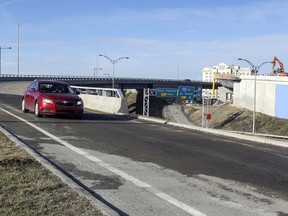 Cars use the new overpass from Trudeau Airport to Highway 20 East, allowing drivers to avoid the Dorval Circle in Dorval, west of Montreal Thursday November 30, 2017.  On the other side of the highway workers put the finishing touches on the westbound ramp which will open soon.