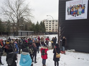 A ceremony held during the 12 Days of Action against violence directed at women commemorates the victims of the Polytechnique massacre and dedicates a wall mural on Ontario St. E. in Montreal on Dec. 6, 2016.