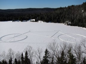 Snow tagging at La Mauricie National Park: Create art on a frozen lake using ropes, snowshoes and sticks, then climb to a lookout to see your art. Photo courtesy of Parks Canada