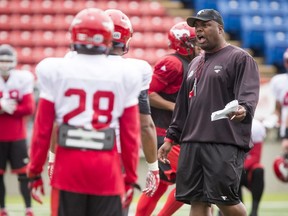 Defensive coordinator DeVone Claybrooks talks to his charges during a Calgary Stampeders practice in Calgary, Alta., on Wednesday, Aug. 10, 2016.