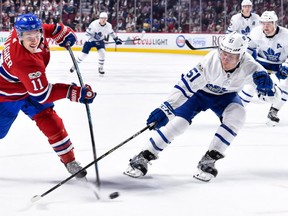Leafs' Jake Gardiner tries to block a shot by Canadiens' Brendan Gallagher at the Bell Centre on Oct. 14, 2017.