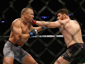 Montreal's Georges St-Pierre fights Michael Bisping of England in their UFC middleweight championship bout during the UFC 217 event at Madison Square Garden on Saturday, Nov. 4, 2017, in New York City.