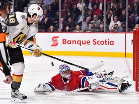 Canadiens' Charlie Lindgren makes a save on Golden Knights' James Neal Tuesday night at the Bell Centre.