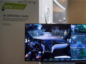 A display demonstrates the sensors and technology behind self-driving cars during the NVIDIA GPU Technology Conference, which showcases artificial intelligence, deep learning, virtual reality and autonomous machines, in Washington, D.C., on Wednesday, Nov. 1, 2017.