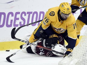 Nashville Predators defenceman P.K. Subban falls on Colorado Avalanche right wing Nail Yakupov during the first period on Saturday, Nov. 18, 2017, in Nashville, Tenn.