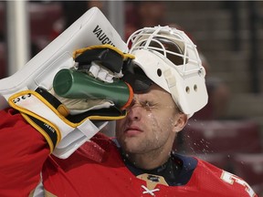 Goalie Antti Niemi squirts water in his face to cool off during game with the Florida Panthers against the Columbus Blue Jackets on Nov. 2, 2017 in Sunrise, Fla.