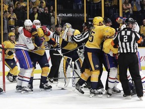 Canadiens  and Predators players fight after a collision at the Nashville net during the third period Wednesday night in Nashville.