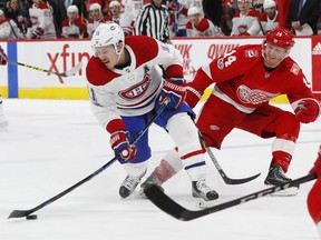 Canadiens' Brendan Gallagher shoots as Red Wings' Gustav Nyquist tries to hinder him Thursday night in Detroit.