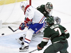 Canadiens winger Brendan Gallagher scores one of his two goals against Wild goalie Devan Dubnyk as centre Matt Cullen (7) watches during the second period in Minnesota Thursday night.