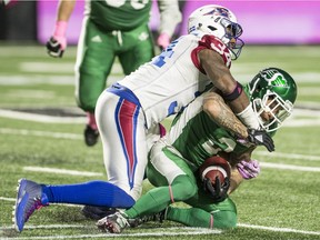 Alouettes linebacker Kyries Hebert flattens Roughriders wide-receiver Chad Owens in Regina on Friday, October 27, 2017.