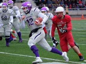 Western Mustangs quarterback Chris Merchant (12) runs with the ball against the Acadia Axemen during first half U Sports semifinal Uteck Bowl football action at Acadia University, in Wolfsville, N.S., on Saturday, Nov. 18, 2017.