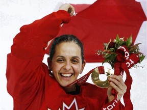 Danielle Goyette, showing off her gold medal as she celebrates Canada's 4-1 victory over Sweden  in the final at the Turin 2006 Winter Olympics, will be enshrined in the Hockey Hall of Fame on Nov. 13.