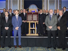 Gary Bettman,

NHL commissioner Gary Bettman, centre right on stage, poses with league general managers at the unveiling of a plaque to commemorate 100 years of the NHL during a ceremony in Montreal, Friday, November 17, 2017. THE CANADIAN PRESS/Graham Hughes ORG XMIT: GMH102
Graham Hughes,
