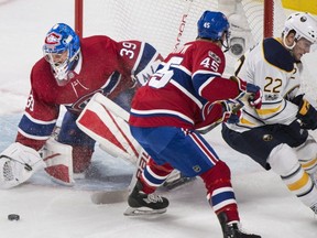 Charlie Lindgren, Joe Morrow, Johan Larsson,

Montreal Canadiens goalie Charlie Lindgren makes a save as Canadiens' Joe Morrow and Sabres' Johan Larsson look for the rebound during first period NHL hockey action in Montreal, Saturday, November 11, 2017. THE CANADIAN PRESS/Graham Hughes ORG XMIT: GMH119
Graham Hughes,