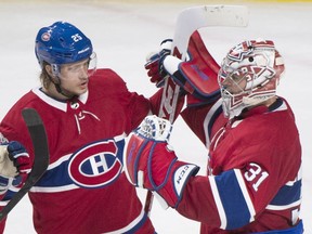 Canadiens goalie Carey Price celebrates with teammate Jacob De La Rose after making 36 saves in a 3-0 shutout victory over the Buffalo Sabres at the Bell Centre in Montreal on Nov. 25, 2017.