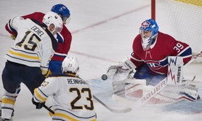 Canadiens goalie Charlie Lindgren makes a save against Buffalo Sabres' Jack Eichel (15) as Sabres' Sam Reinhart and Canadiens' Shea Weber look for the rebound during first period NHL hockey action in Montreal on Saturday, Nov. 11, 2017.