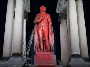 A statue of Sir John A. Macdonald is shown covered in red paint in Montreal, Sunday, November 12, 2017.