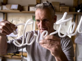 "They used to say you made it when you get your name in neon lights," says Gerald Collard says, seen with one of his latest creations on Wednesday, Nov. 1, 2017.