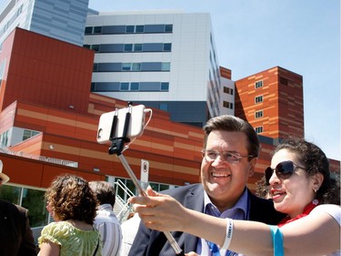 Denis Coderre poses for a selfie with a participant during the Walk for Montreal to inaugurate the new MUHC Glen site in Montreal on Saturday June 20, 2015.