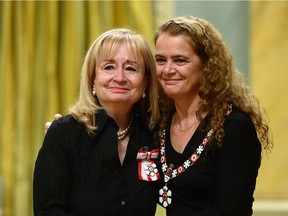 Julie Payette, Governor General of Canada, presents the Order of Canada to Louise Champoux-Paille of Montreal at Rideau Hall in Ottawa on Friday Nov. 17, 2017. THE CANADIAN PRESS/Sean Kilpatrick