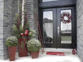 Illuminated trees and plants outside your front door offer a festive welcome to holiday guests.