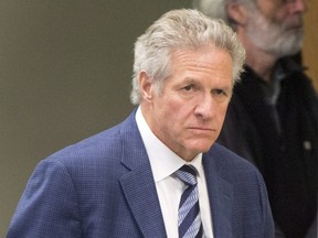 Former construction magnate Tony Accurso walks to the courtroom at his trial in Laval, Quebec on Monday, November 13, 2017.