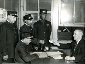 Porters Winslow (no other name available); Jean Napoleon Maurice, Sam Morgan and (seated) James Thompson get their assignments from W.A. Gough, sleeping agent at Windsor station in Montreal in August 1944. Until the 1950s, most black men in Montreal worked for the railway companies as sleeping car porters, red caps and some categories of dining car employees, historian Steven High writes.