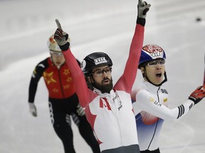 Charles Hamelin of Ste-Julie celebrates after winning the me's 1500 meter final race at the ISU World Cup Short Track Speed Skating competition in Seoul, South Korea, on Saturday, Nov. 18, 2017.