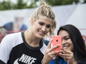 Back in July 2017, Eugenie Bouchard takes a selfie with a fan at the Rogers Cup.